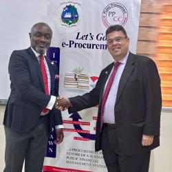 PPCC Executive Director, Bodger Scott Johnson, shakes hands with Joseph Zadrozny, the United States Chargé d’Affaires to Liberia.