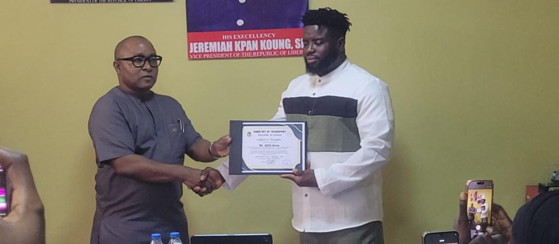 Hon. Sirleaf R. Tyler  Certificates Mr. Selikie Sesay as First Liberian to Drive from France to Liberia by Land.