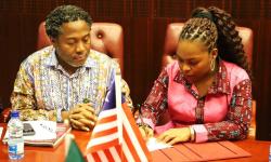 Assistant Minister Charlyne A. Taylor with Dr. Ibrahim Nyei