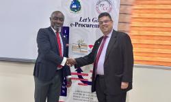 PPCC Executive Director, Bodger Scott Johnson, shakes hands with Joseph Zadrozny, the United States Chargé d’Affaires to Liberia.
