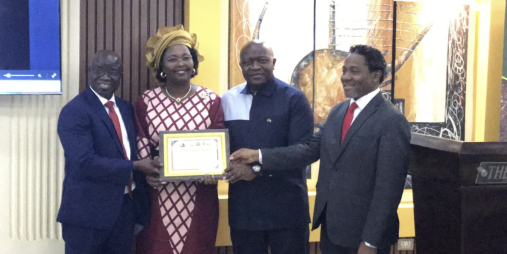  (IFAD) Country Representative Madam Pascaline Barankeba receiving a certificate of Appreciation from the government of Liberia